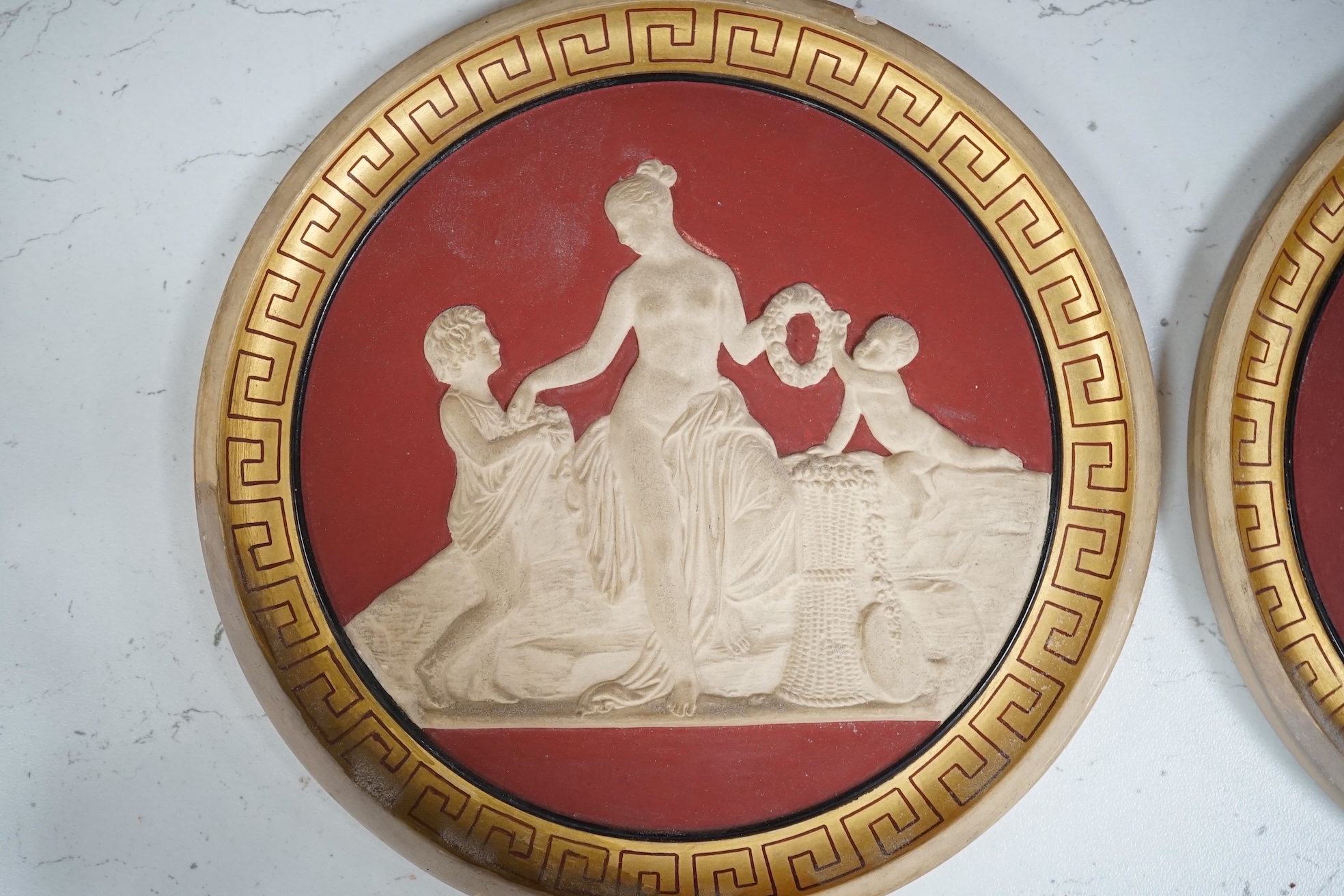 A set of four Neoclassical style terracotta plaques, P. Ipsen, ‘The Four Seasons’, by Bertel Thorvaldsen, each stamped to the base, 17cm in diameter. Condition - some restoration